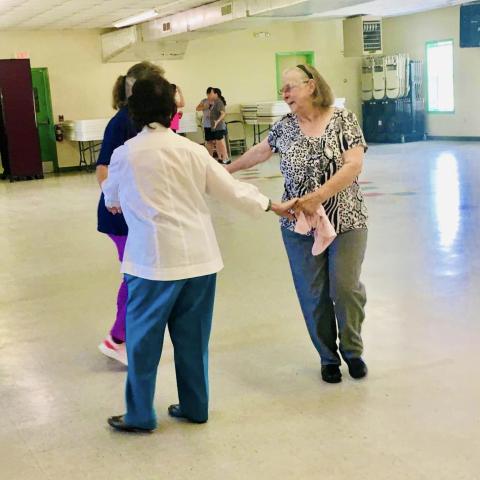 Image of women dancing together