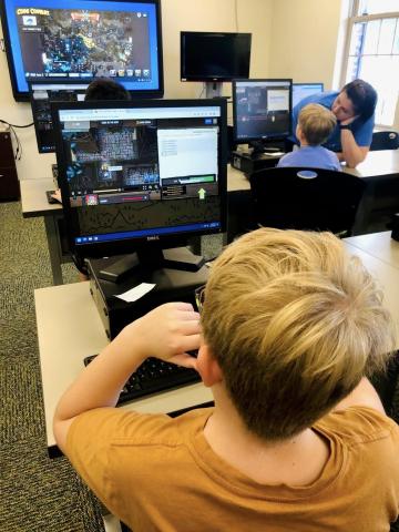 Image of kids playing video games on computer