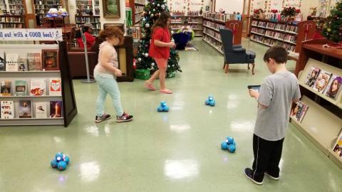 Image of kids playing with robots