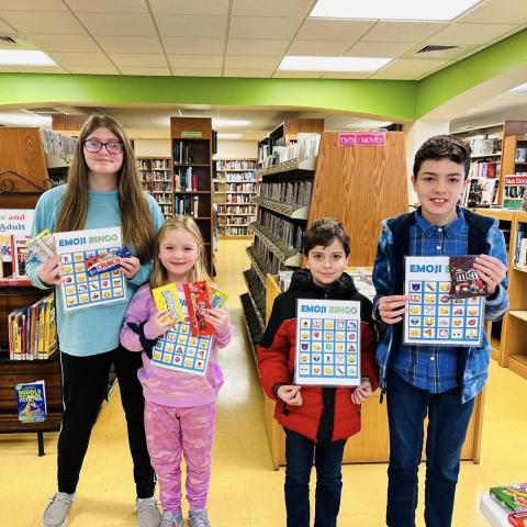 Image of kids holding bingo cards