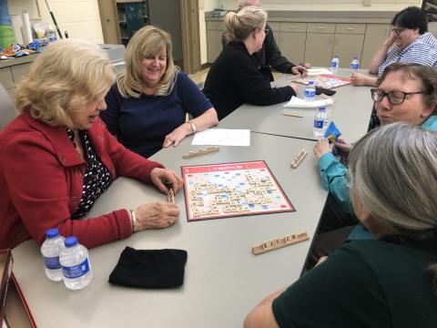 Image of people playing Scrabble