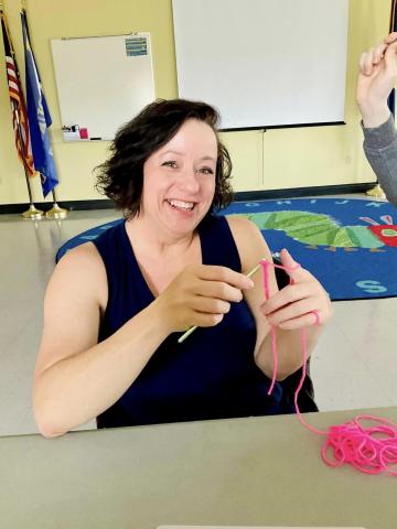 Image of woman crocheting