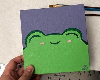 Image of frog face painted on canvas