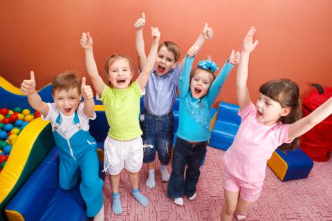 Image of kids throwing hands in air