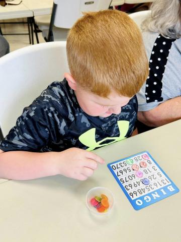 Image of child playing bingo