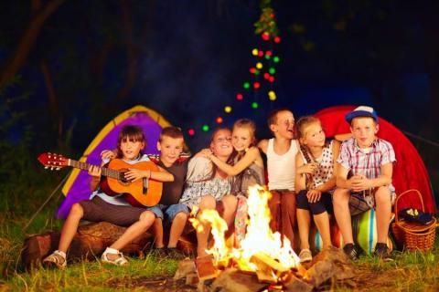 Image of kids sitting around a campfire