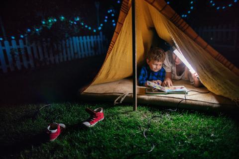 Image of reading while camping