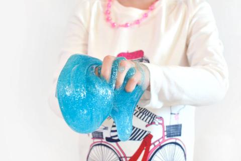 Image of child holding slime