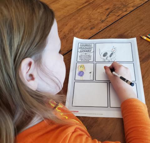 Image of kid making a graphic novel