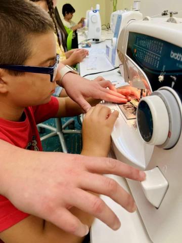 Image of kids sewing