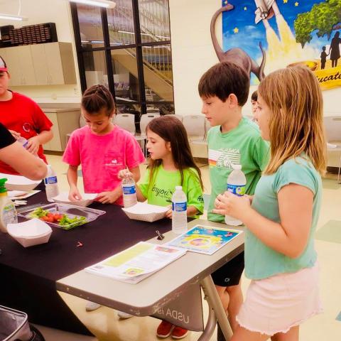 Image of kids preparing healthy snack