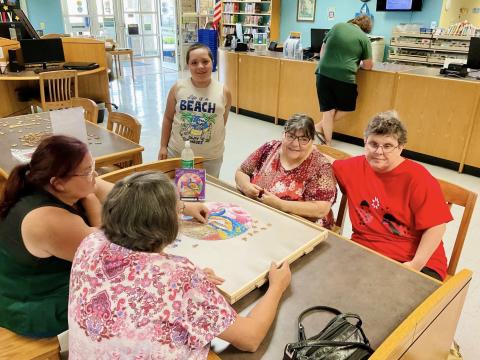 Image of people doing a puzzle