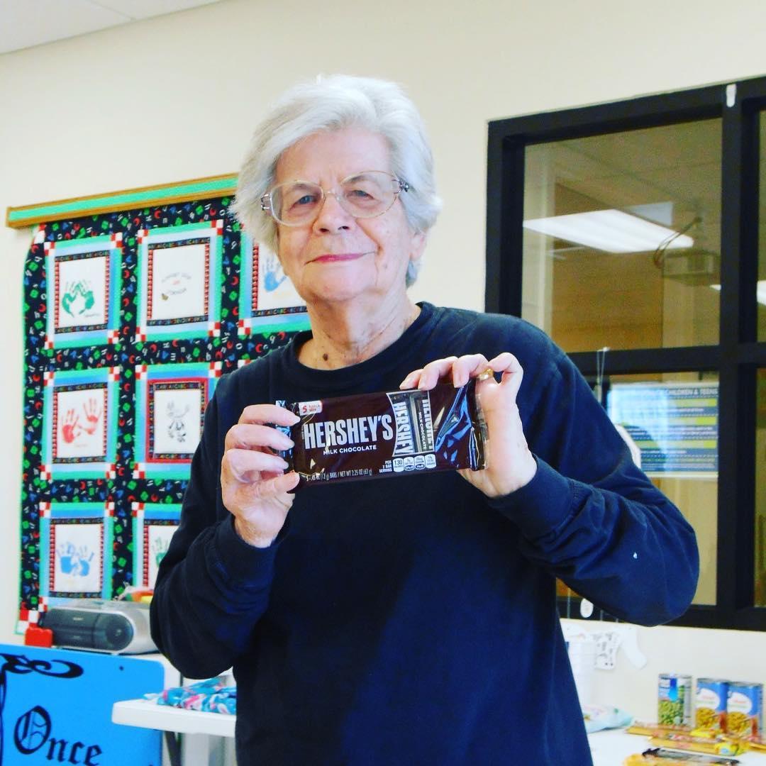 Image of woman holding bingo prize