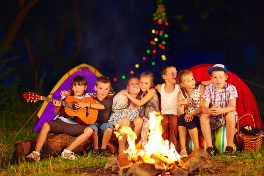 Image of kids sitting around a campfire