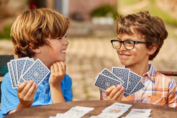 Image of kids playing cards