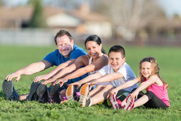 Image of family exercising together