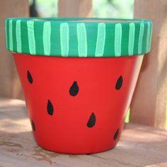 Image of terra cotta pot painted like a watermelon