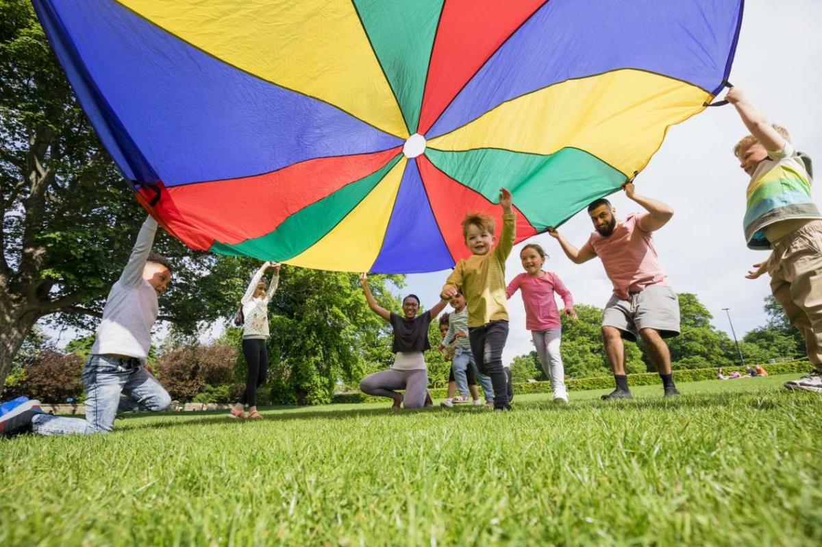 Image of kids playing parachute